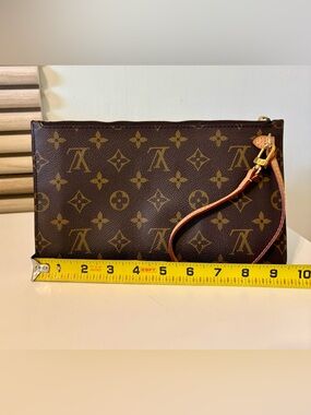 Louis Vuitton Monogram Neverfull Pouch.